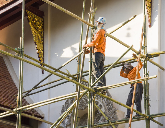 Workers on a bamboo scaffolding