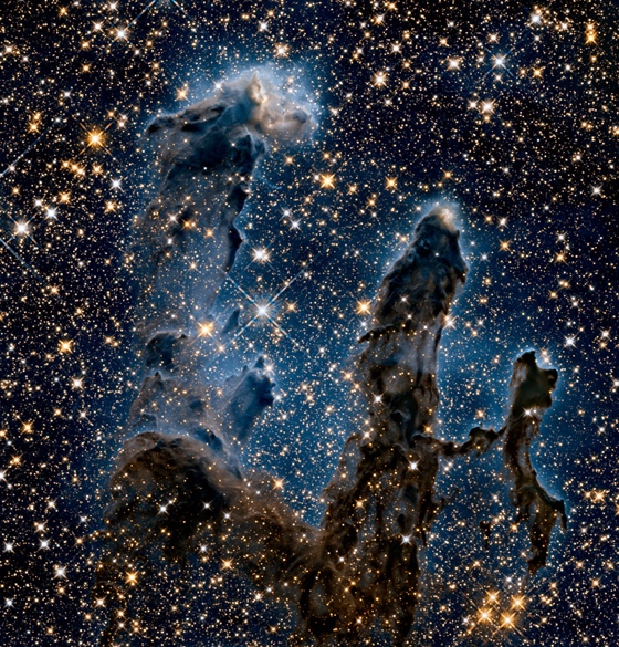The Pillars of Creation (dust clouds in the Eagle Nebula) seen in infrared