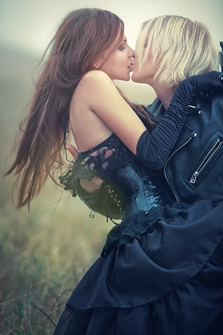 Goth couple kissing passionately