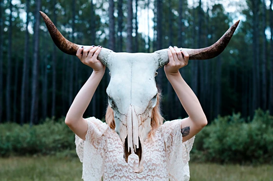 Woman with a buffalo skull